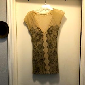 Tan sheer with a black pattern on the front